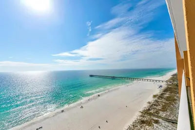 an aerial view of a beach with a pier at Sterling Reef 1404 in Panama City Beach