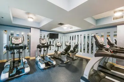 a gym with several cardio machines in a room at Calypso 2-2108 West in Panama City Beach