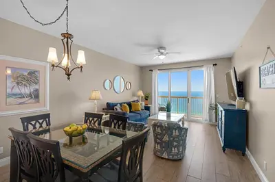 a dining room and living room with a dining table at Calypso 2-2108 West in Panama City Beach
