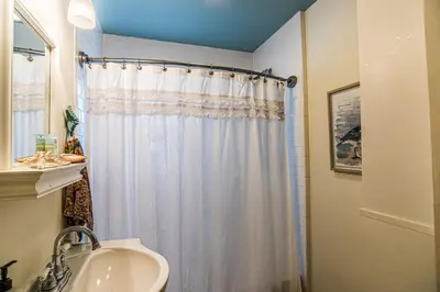 a bathroom with a shower curtain and a sink at A Wave From It All in Laguna Beach Large Patio Sleeps 4 Dog Ok in Panama City Beach