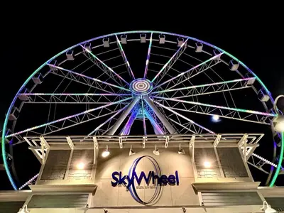 a large ferris wheel is lit up at night at A Wave From It All in Laguna Beach Large Patio Sleeps 4 Dog Ok in Panama City Beach