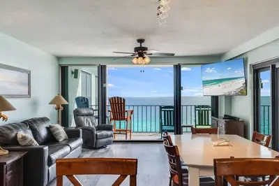 a living room with a view of the ocean at Watercrest 1510 - Timeless Memories Stunning views in Panama City Beach