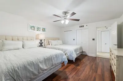 a bedroom with two beds and a ceiling fan at Watercrest 1405 - Crystal-Gulf Overlook - Sleeps 8 in Panama City Beach