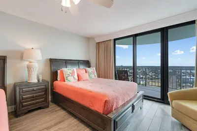 a bedroom with a bed and a large window at Watercrest 1201 - Swell Life - Sleeps 8 2 BR 2 BA in Panama City Beach