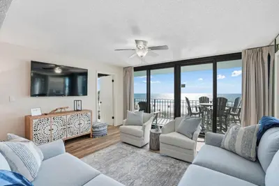 a living room with a view of the ocean at Watercrest 207 3 BR 3 BA with 2 Beachfront Masters in Panama City Beach