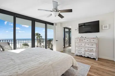 a bedroom with a bed and a ceiling fan at Watercrest 207 3 BR 3 BA with 2 Beachfront Masters in Panama City Beach