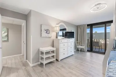 a bedroom with a bed and a television at Watercrest 210- Sleeps 12 - Thomas Drive Retreat in Panama City Beach