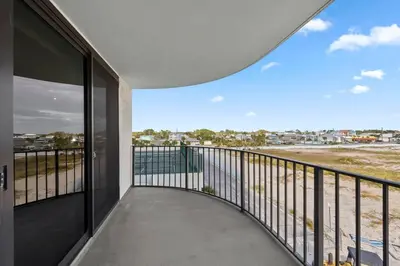 a balcony with a view of the ocean at Watercrest 401 Amazing wrap around balcony in Panama City Beach