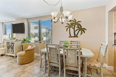 a dining room with a table and chairs at Watercrest 209 White-Sands Getaway - Sleeps 8 in Panama City Beach