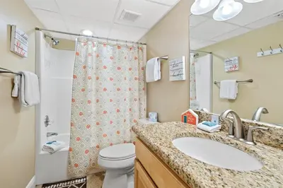 a bathroom with a sink and a toilet and a shower at Watercrest 209 White-Sands Getaway - Sleeps 8 in Panama City Beach