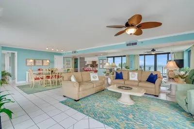 a living room with a couch and a table at Watercrest 203 - Emerald Shore Overlook 2 BR 2 BA in Panama City Beach