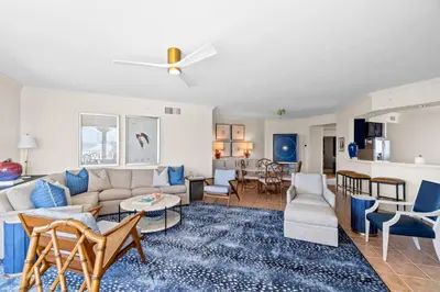 a living room with a couch and a table at Grande Surf Club 11E in Panama City Beach