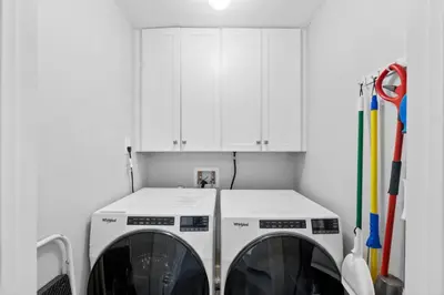 a laundry room with a washer and dryer at Family-Friendly 4BR Beachfront Retreat w/ Indoor & Outdoor Pools in Panama City Beach