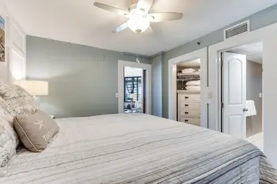 a bedroom with a bed and a ceiling fan at Sunbird 407E - Pearl Gulf Getaway - Sleeps 4 in Panama City Beach