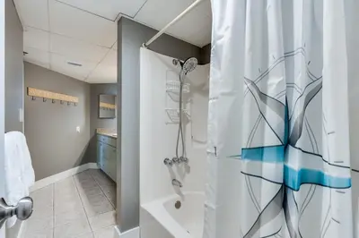 a bathroom with a shower and a sink at Sunbird 407E - Pearl Gulf Getaway - Sleeps 4 in Panama City Beach