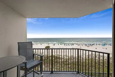 a balcony with a view of the beach at Sunbird 407E - Pearl Gulf Getaway - Sleeps 4 in Panama City Beach