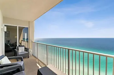 a balcony with a view of the ocean at Tidewater 2405 - Tidewater Peak Sleeps 6 - 2Br 2Ba in Panama City Beach