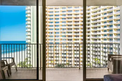 a balcony with a view of a large building at Shores of Panama 926 - Shore-Gulf Peak- 2 BR 2 BA in Panama City Beach