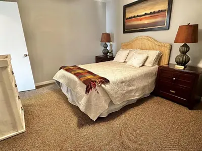 a bedroom with a large bed with two night stands at Horizon South 33D - Sunstead Retreat - Sleeps 6 in Panama City Beach