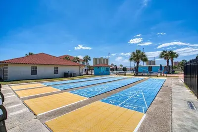 a swimming pool with yellow and blue tiles at Horizon South 33D - Sunstead Retreat - Sleeps 6 in Panama City Beach