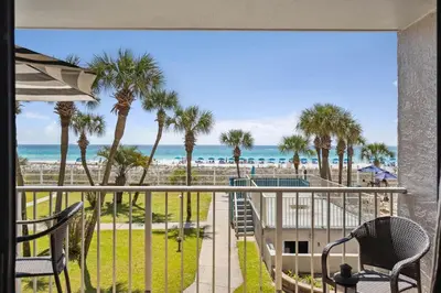 a balcony with chairs and a view of the beach at Summit 225 - Low floor beachfront - Sleeps 5 in Panama City Beach