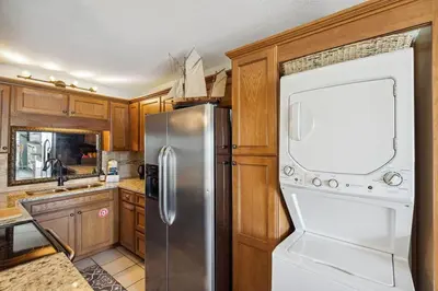 a kitchen with a stainless steel refrigerator and a dishwasher at Summit 225 - Low floor beachfront - Sleeps 5 in Panama City Beach