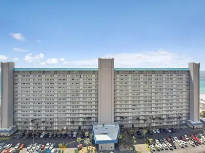 a large building with a parking lot in front of it at Summit 225 - Low floor beachfront - Sleeps 5 in Panama City Beach