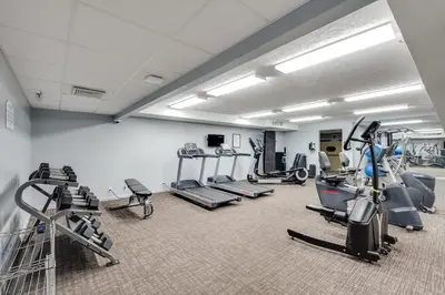 a gym with several treadmills and machines in a room at Gulf Peak Retreat - Watercrest 2 BR 2 BA - Sleeps in Panama City Beach