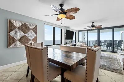a dining room with a table and chairs and a ceiling fan at Gulf Peak Retreat - Watercrest 2 BR 2 BA - Sleeps in Panama City Beach