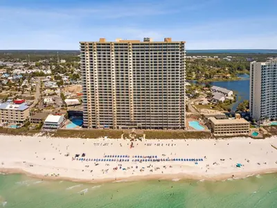an aerial view of a beach with a large building at Tidewater 2411 - Tidewater Retreat - Sleeps 8 in Panama City Beach