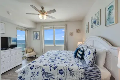 a bedroom with a bed and a ceiling fan at Shores of Panama 1403 - 3 BR 2 Ba Newly Renovated in Panama City Beach