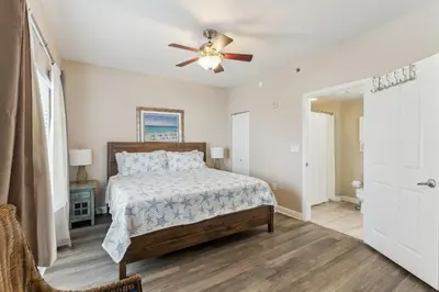 a bedroom with a bed and a ceiling fan at Peak-Shore Overlook - Sleeps 8 in Panama City Beach