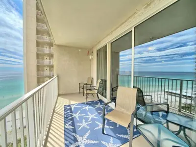 a balcony with chairs and a view of the ocean at Shores of Panama 1307, Two Masters! in Panama City Beach