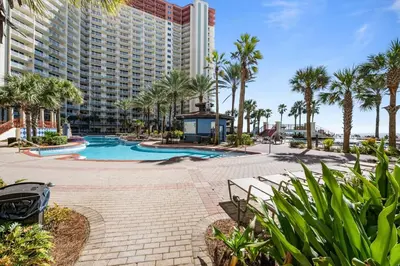 a resort with a swimming pool and palm trees at Shores of Panama 2115, 2BR 2 BA, sleeps 6 in Panama City Beach