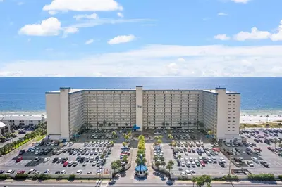 an aerial view of a hotel with a parking lot at Regency Towers 207 - Sleeps 8 -East-Gulf Overview in Panama City Beach