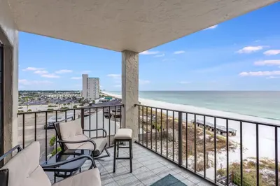 a balcony with chairs and a view of the beach at Moondrifter 804 - Sleeps 6 - 2 BR 2 BA with bunks in Panama City Beach