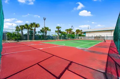 a tennis court with a net on top of it at Moondrifter 804 - Sleeps 6 - 2 BR 2 BA with bunks in Panama City Beach