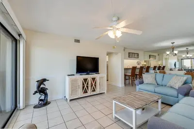 a living room with a couch and a tv at Moondrifter 305 - 2 BR - Oceanfront condo Sleeps 6 in Panama City Beach