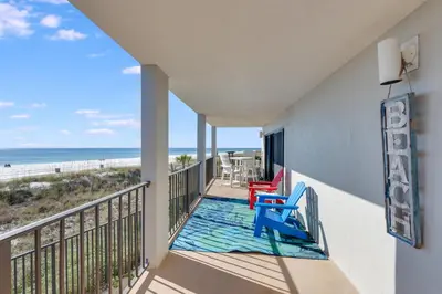 a balcony with a view of the beach at Sand-Crest Overlook - Moondrifter 201 in Panama City Beach