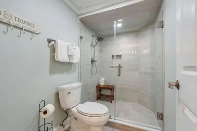 a bathroom with a toilet and a shower at Edgewater T1 #709 - Sleeps 6 Amazing gulf views! in Panama City Beach