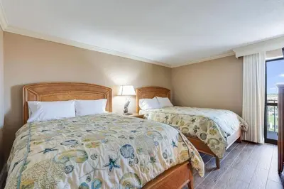 a bedroom with two beds and a window at Edgewater Tower 1 #609 - Lagoon Tower - 2 BR 2 BA in Panama City Beach