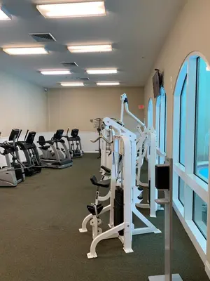 a gym with treadmills and elliptical machines at Celadon 109 - 3BR 3BA in Panama City Beach