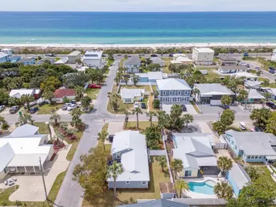 an aerial view of a resort with the ocean at 13900 Millcole Ave - Beachy Bungalow - Sleeps 10 in Panama City Beach