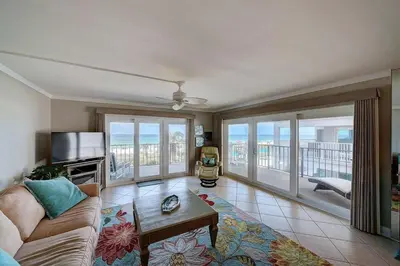 a living room with a couch and a television at Mariner East #201 1 BR 2 BA Amazing Balcony! in Panama City Beach
