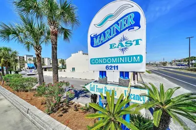 a sign for a mariner eastost condominiumitution at Mariner East #201 1 BR 2 BA Amazing Balcony! in Panama City Beach