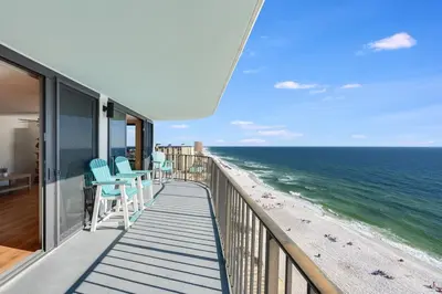 a balcony with chairs and a view of the beach at Watercrest 1603 - 2 BR 2 BA Beachfront Balcony in Panama City Beach