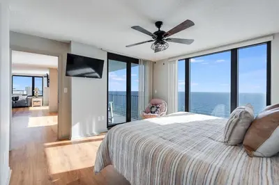 a bedroom with a bed and a ceiling fan at Watercrest 1603 - 2 BR 2 BA Beachfront Balcony in Panama City Beach