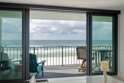 a balcony with a view of the ocean at Watercrest 408 - 2BR 2BA - Emerald Gulf Paradise in Panama City Beach