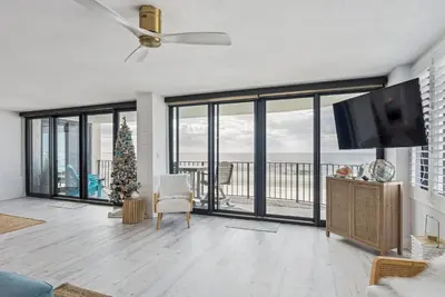 a living room with a ceiling fan and a television at Watercrest 408 - 2BR 2BA - Emerald Gulf Paradise in Panama City Beach