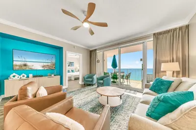 a living room with a couch and a table at Boardwalk 2101 in Panama City Beach